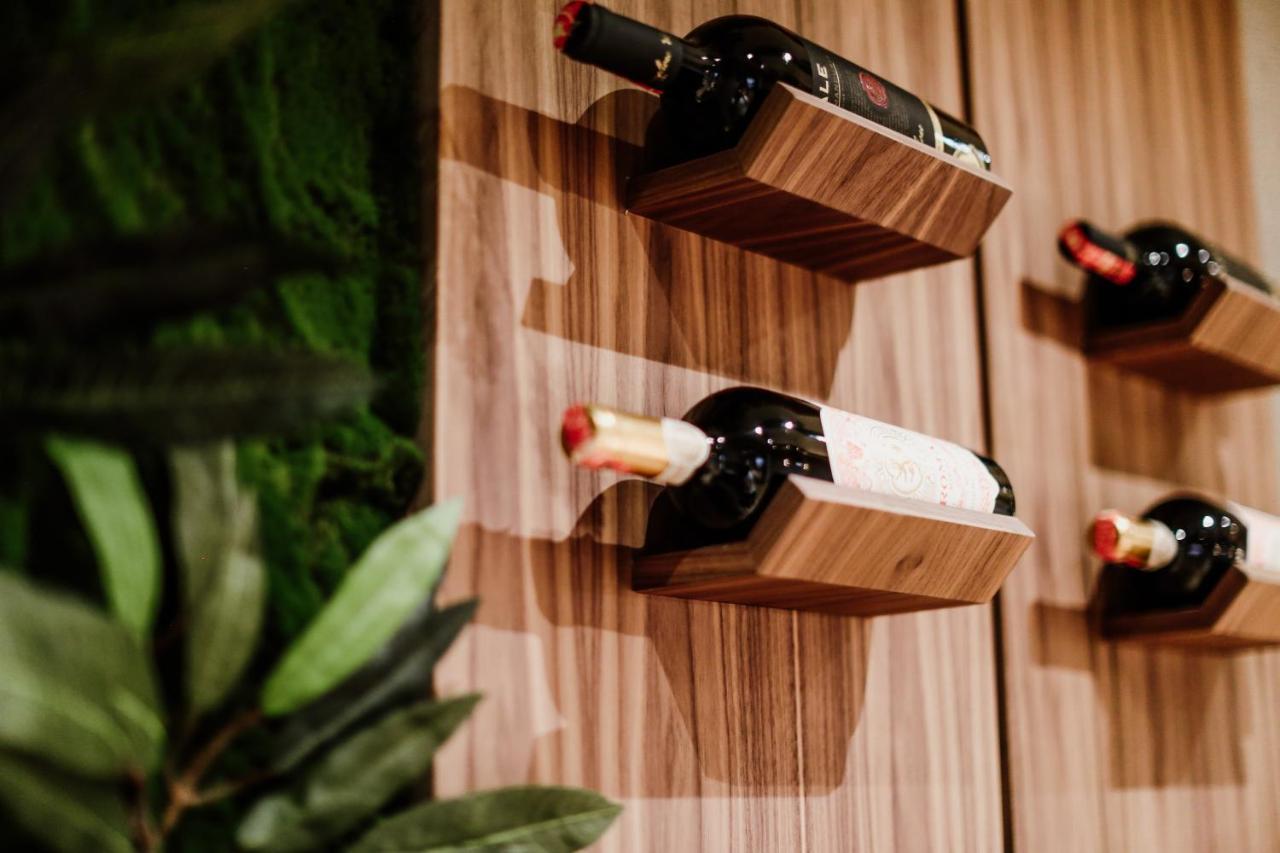 Klajdi Resort & Spa Голем Екстериор снимка Wine bottles stored on a wall mounted wine rack